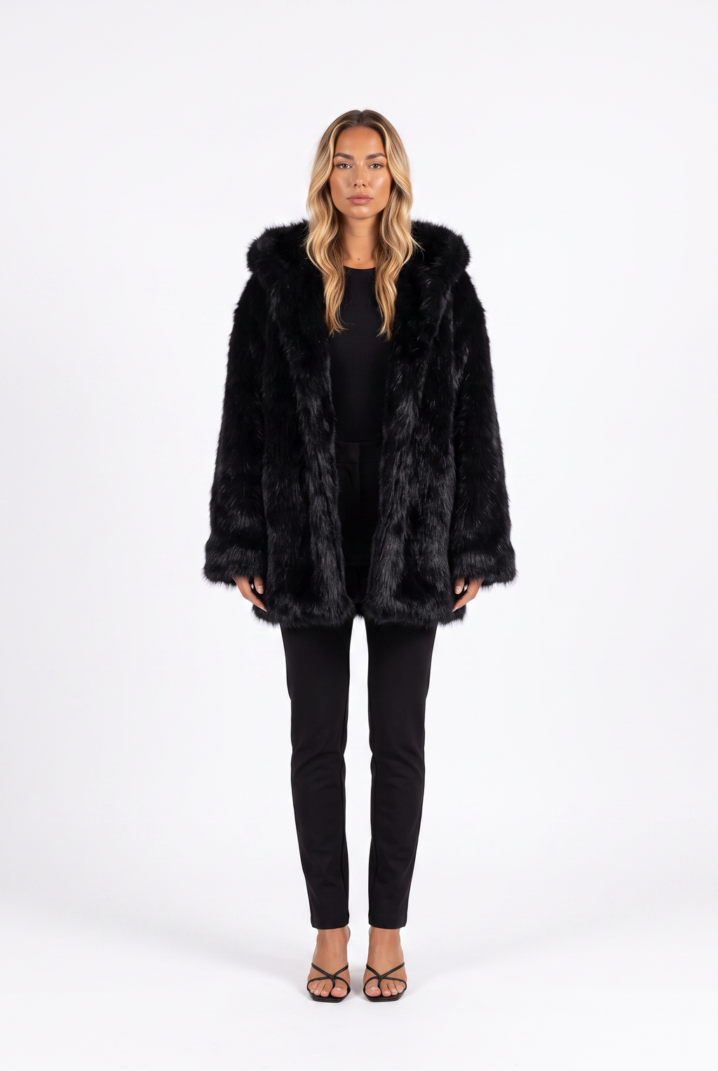 Oversized shaggy faux fur hooded coat in black — front