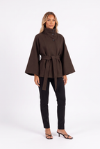 Dark brown belted cape jacket with funnel collar — three-quarter
