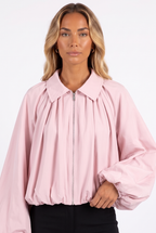Pale pink balloon-sleeve zip jacket — collar, zip and sleeve detail