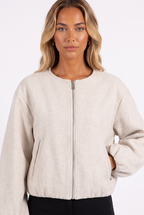 Oat beige crew-neck zip bomber with balloon sleeves — zip, pocket and sleeve detail
