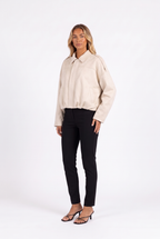 Cream faux-suede cropped bomber with epaulettes — three-quarter