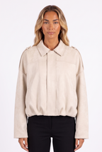 Cream faux-suede cropped bomber with epaulettes — collar, placket and epaulette detail