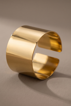 Close-up of the smooth band and open end of the gold cuff