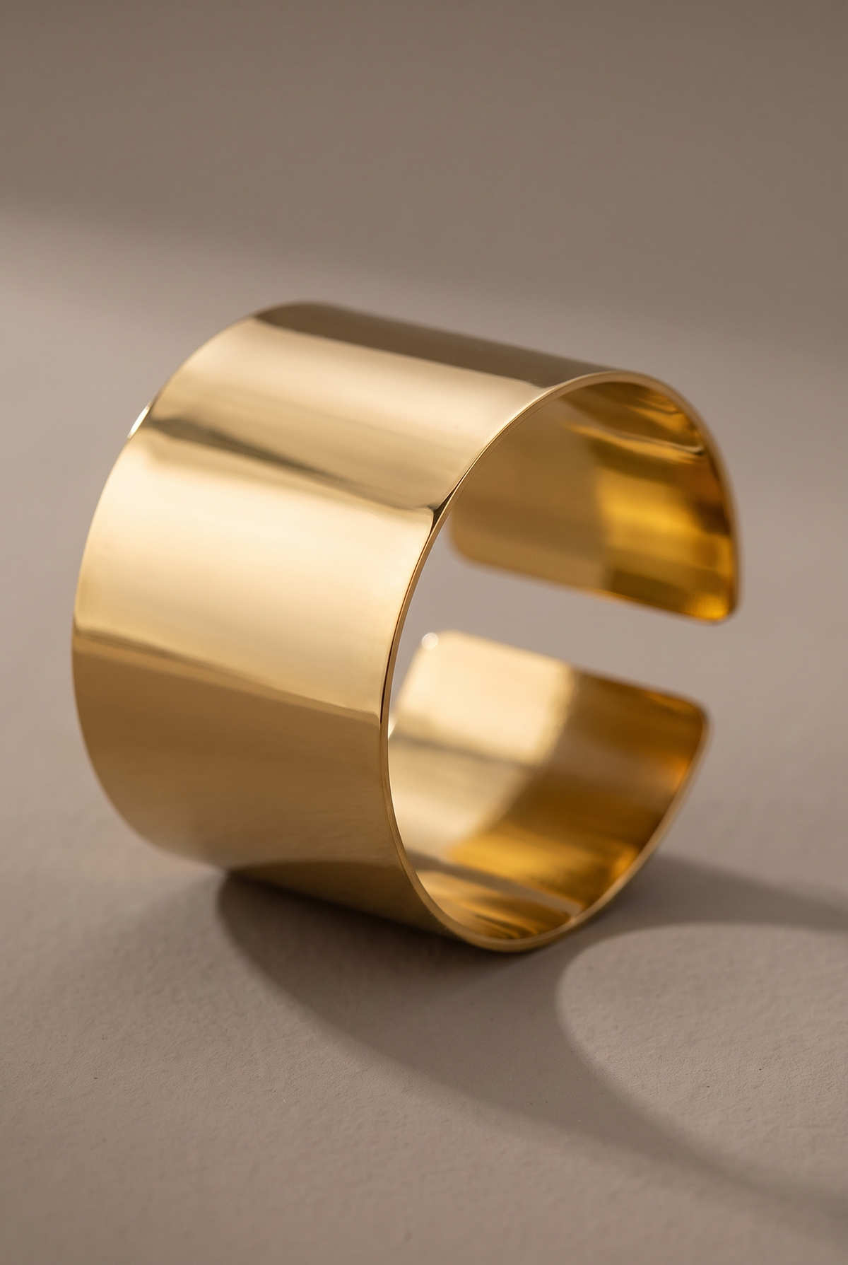 Close-up of the smooth band and open end of the gold cuff