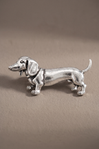 Close-up of the sculpted dachshund brooch