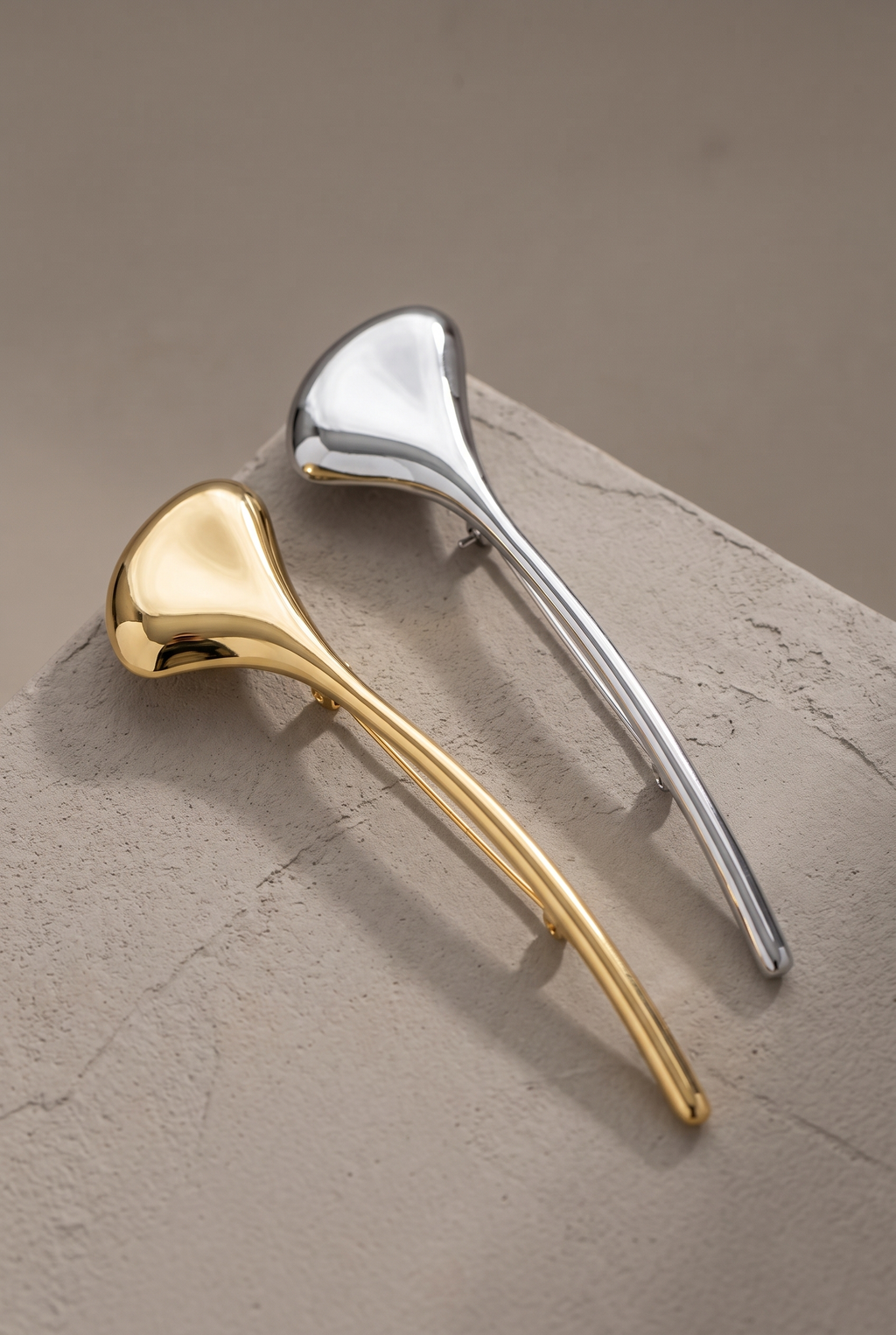 DropIQ sculpted petal stick brooch in gold and silver