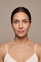 White rice pearl strand worn at the collarbone