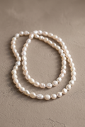 DropIQ long knotted white baroque pearl strand
