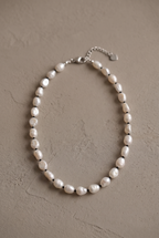 DropIQ white baroque pearl necklace with black spacer beads